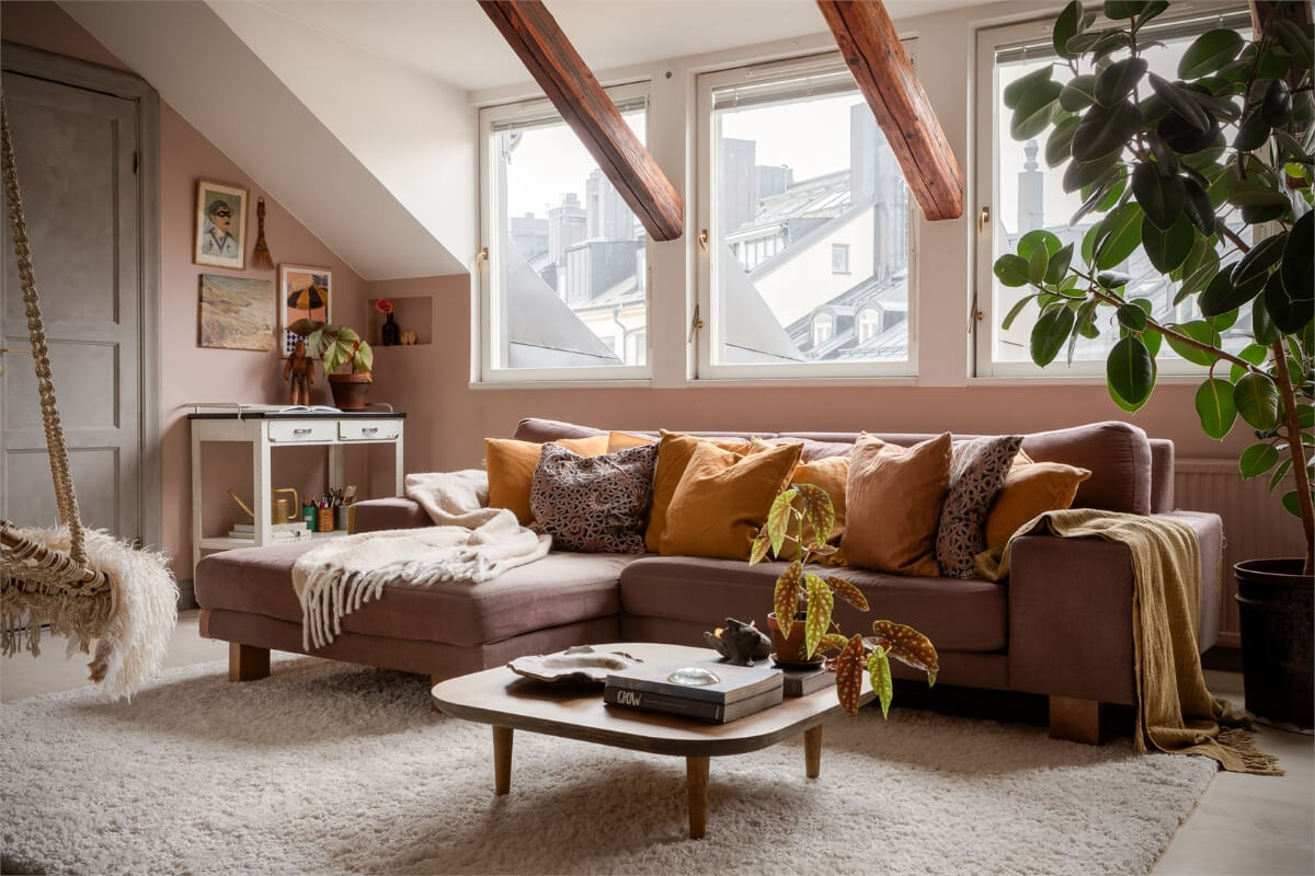 A Colorful Family Attic Apartment in Stockholm 8 living room yellow cushions