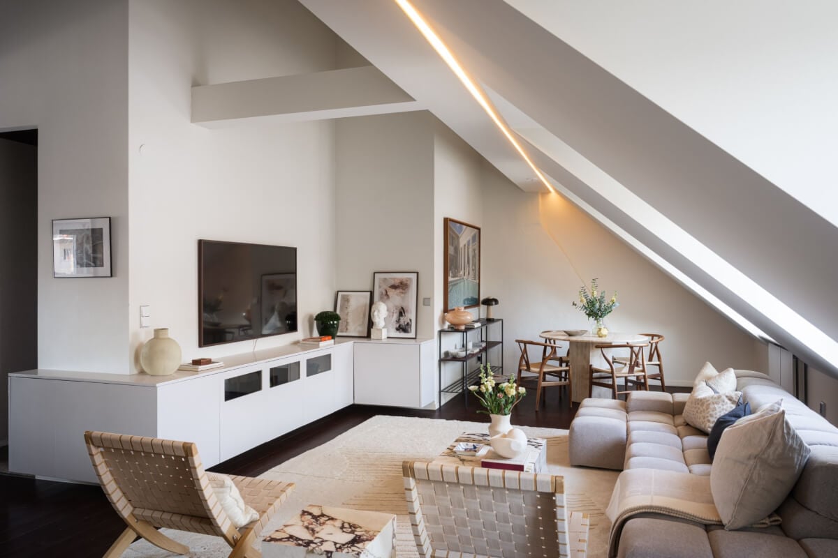 A Light Penthouse Apartment with Built-In Bookshelves 4 living space with slanted ceiling