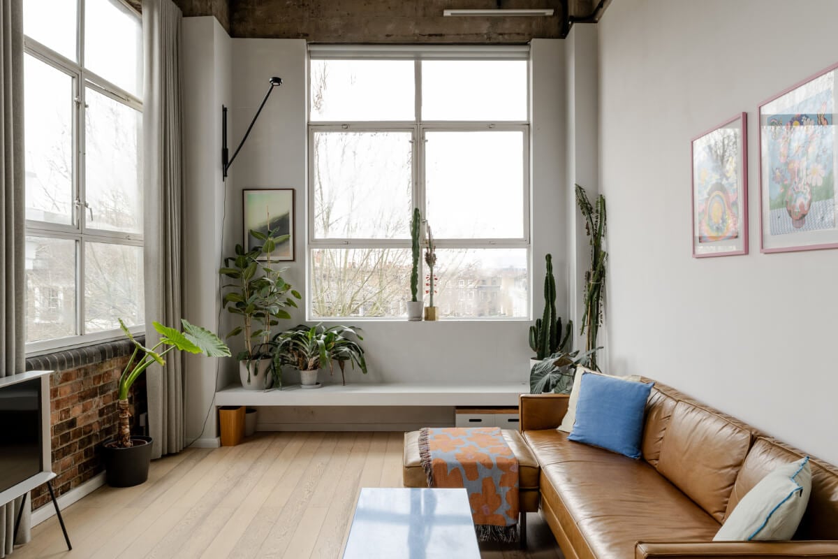 loft living room large windows exposed brick