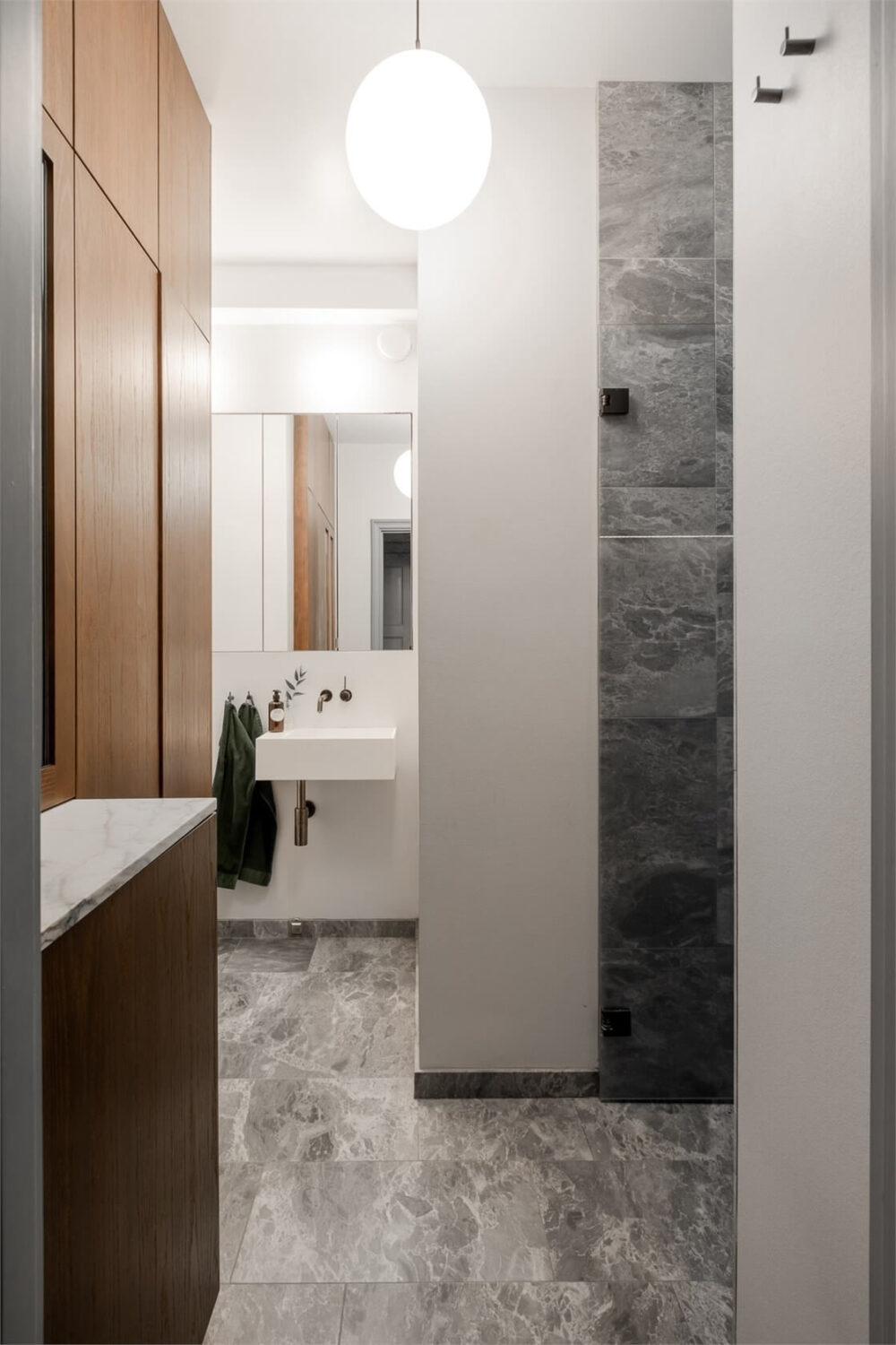 A Small Stockholm Apartment with a Blue Shaker Kitchen 21 modern bathroom with storage