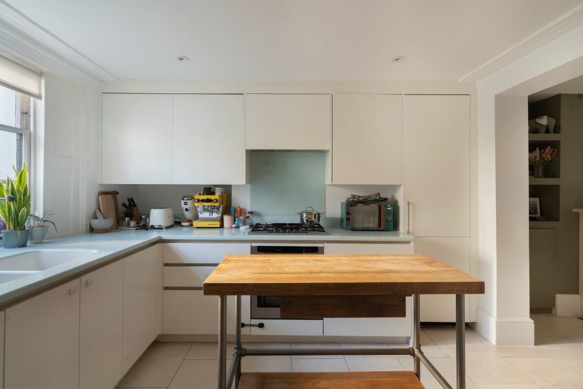 Contemporary Interiors and Preserved Details in an Early Victorian House 9 modern white kitchen