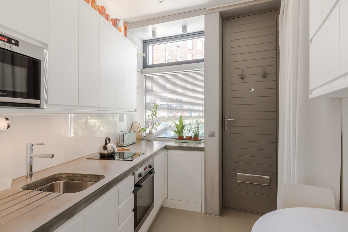 A Narrow Five-Story House with a Roof Garden in London's Clerkenwell 2 modern white kitchen