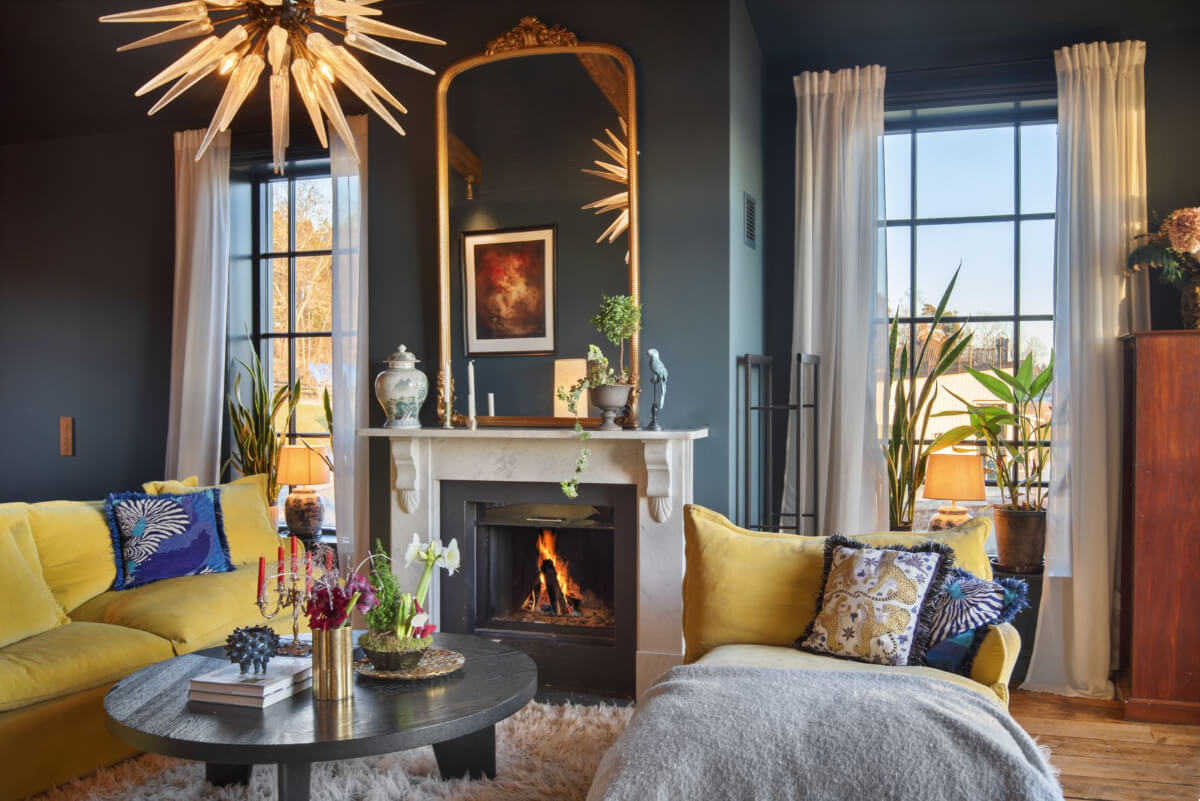 moody sitting room fireplace ochre yellow seating