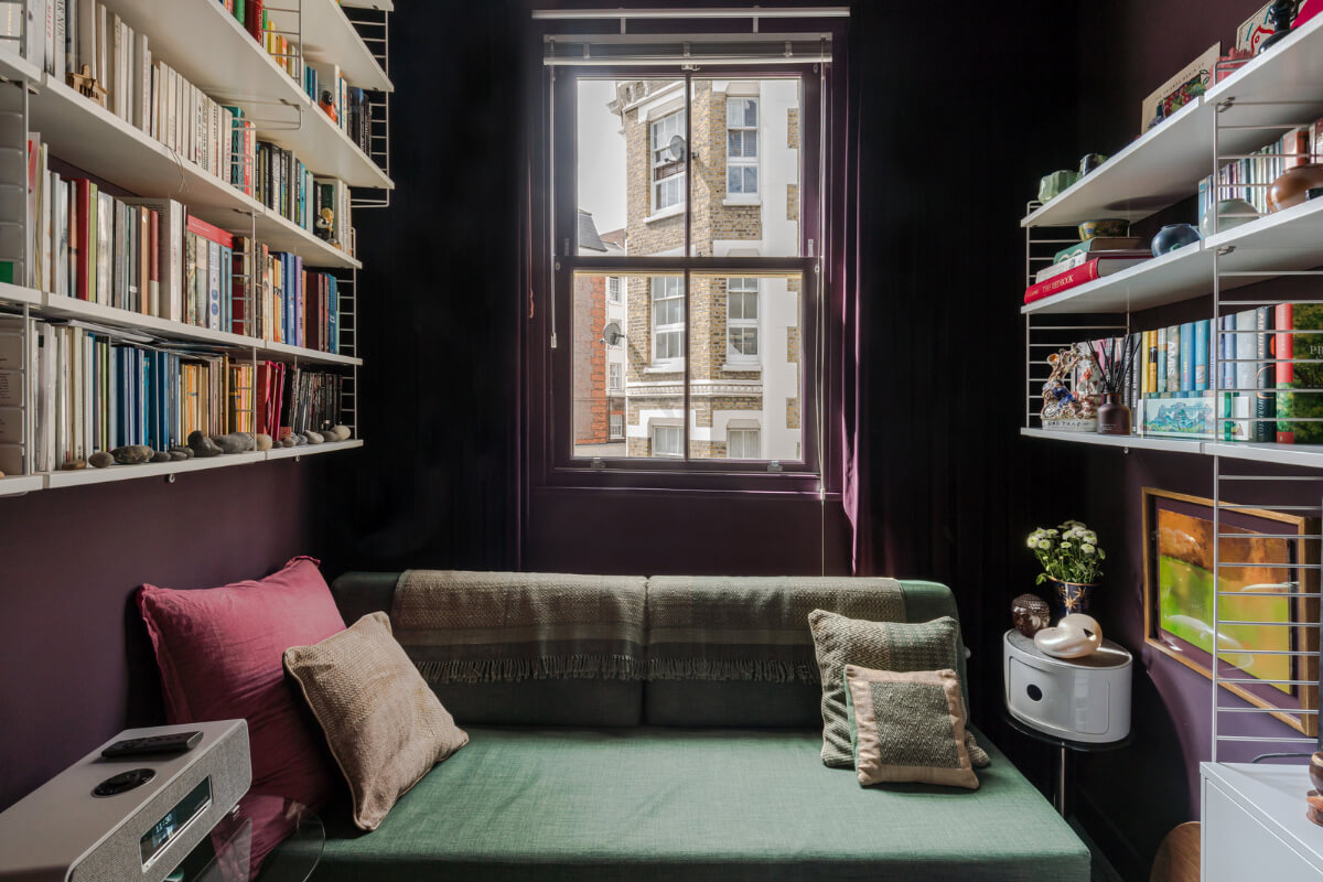 A Narrow Five-Story House with a Roof Garden in London's Clerkenwell 9 narrow living room purple walls bookshelves