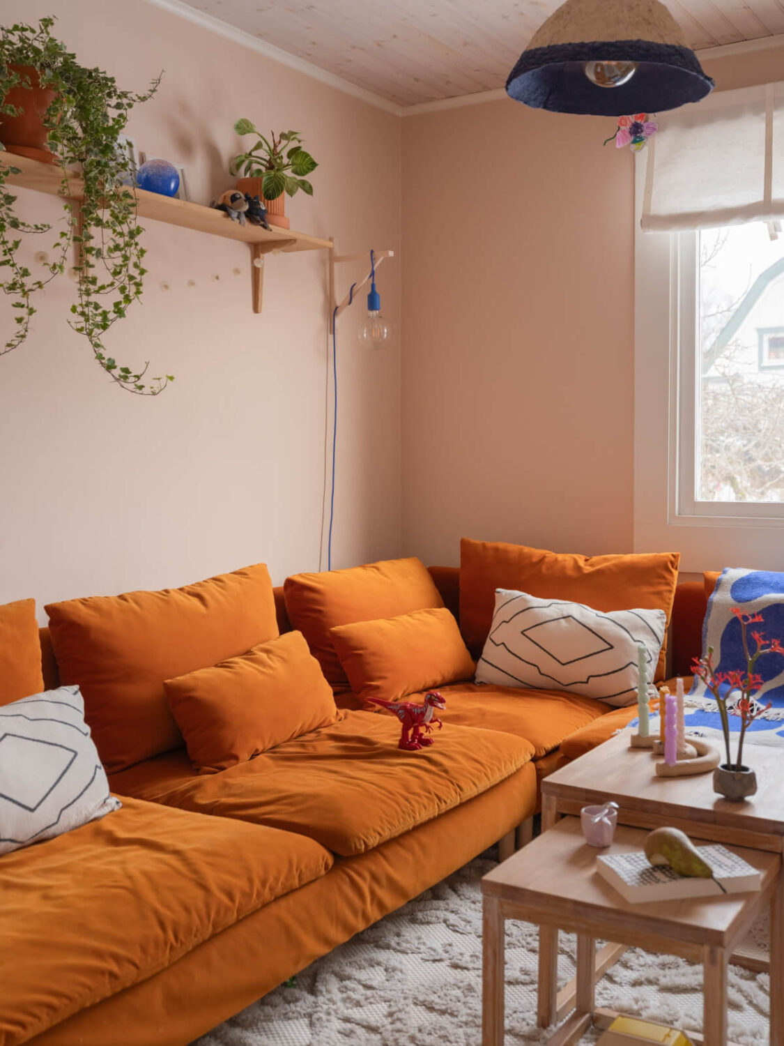 Colorful Decor in a Charming Family Duplex Apartment in Stockholm 18 ochre sofa light pink living room