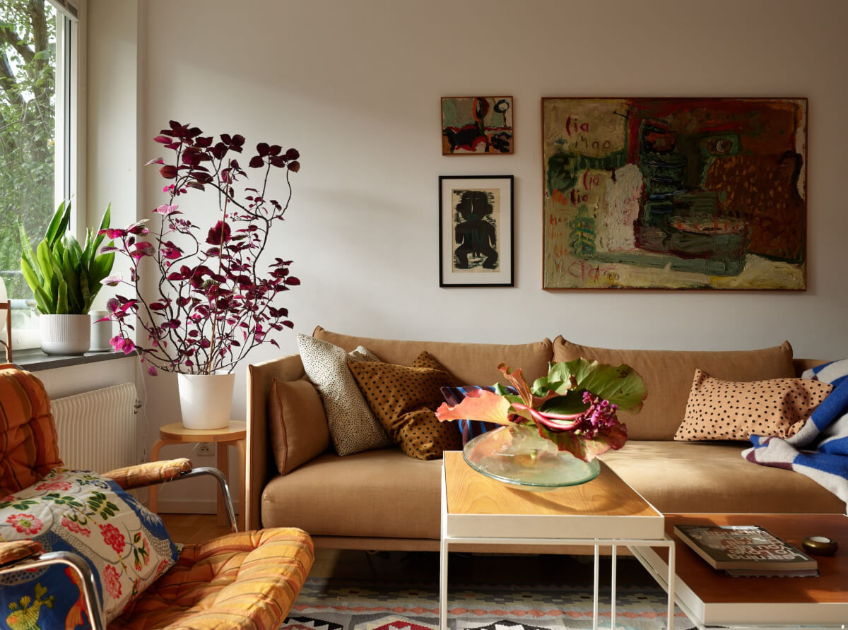 A Lovely Color Palette in a Midcentury Apartment in Sweden 3 ochre yellow sofa
