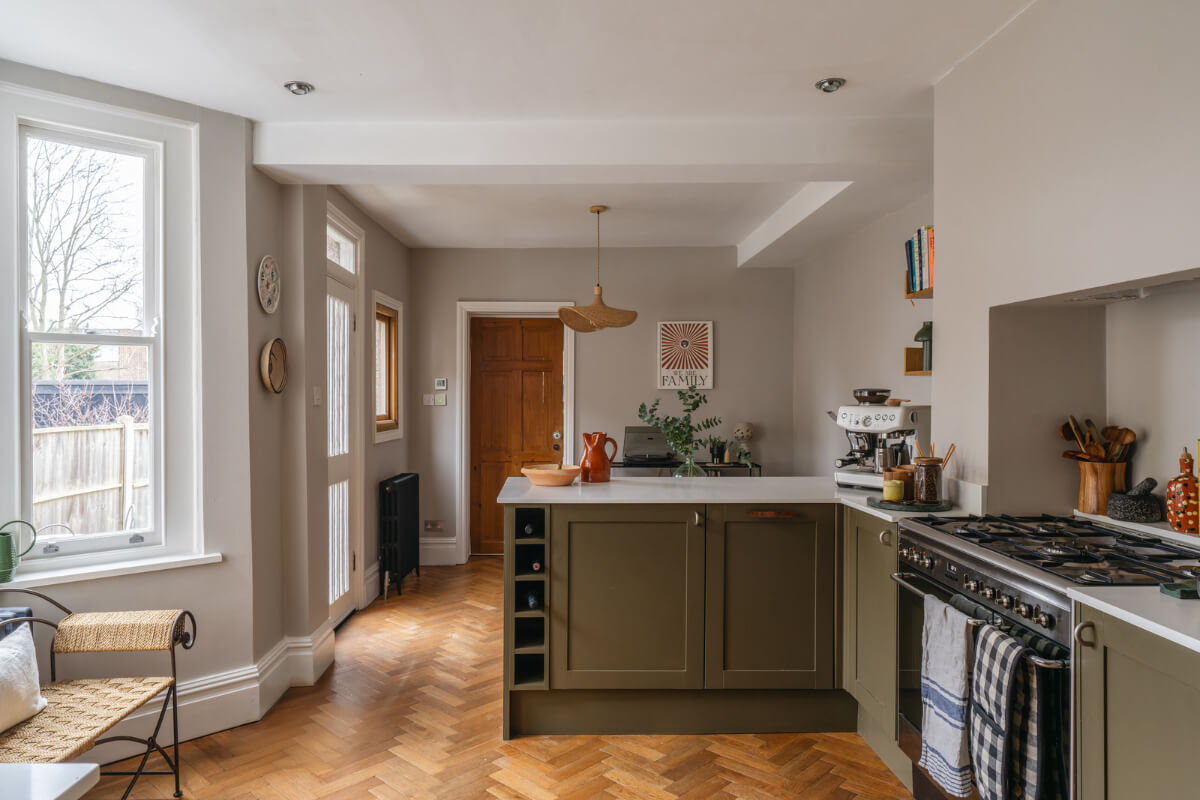 A Charming Garden Apartment in a Victorian House 4 olive green kitchen herringbone parquet floor