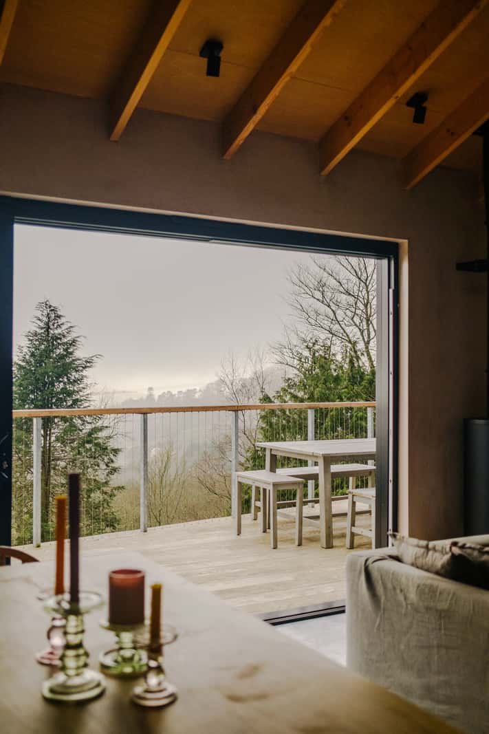 A Japanese-Inspired Timber Home with Views of a Lush Valley 9 open doors living space