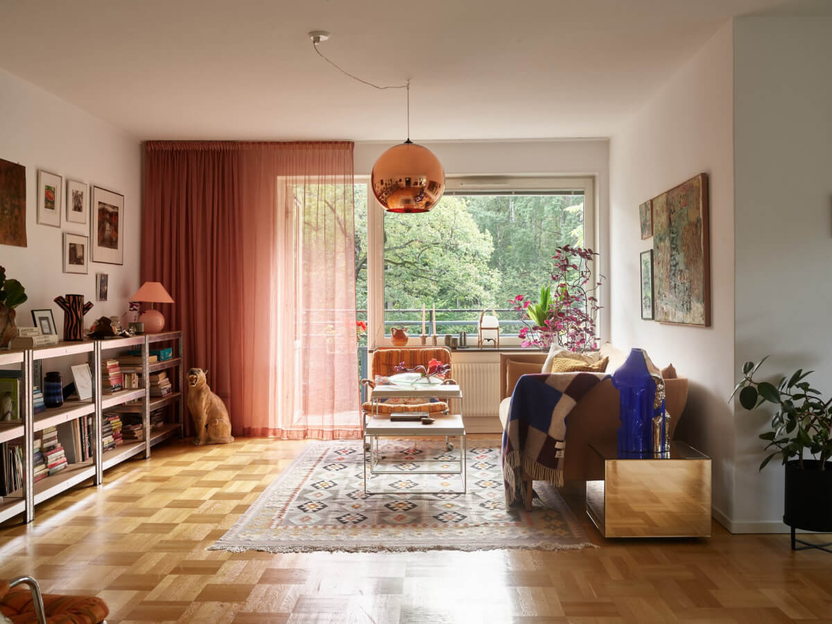 A Lovely Color Palette in a Midcentury Apartment in Sweden 1 open living room parquet floor midcentury apartment