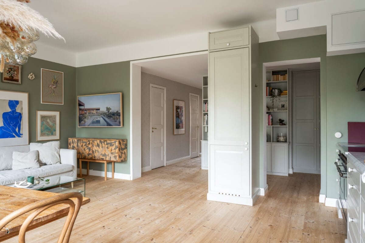 A Light Swedish Apartment with a Green Living Room 12 open plan green living space