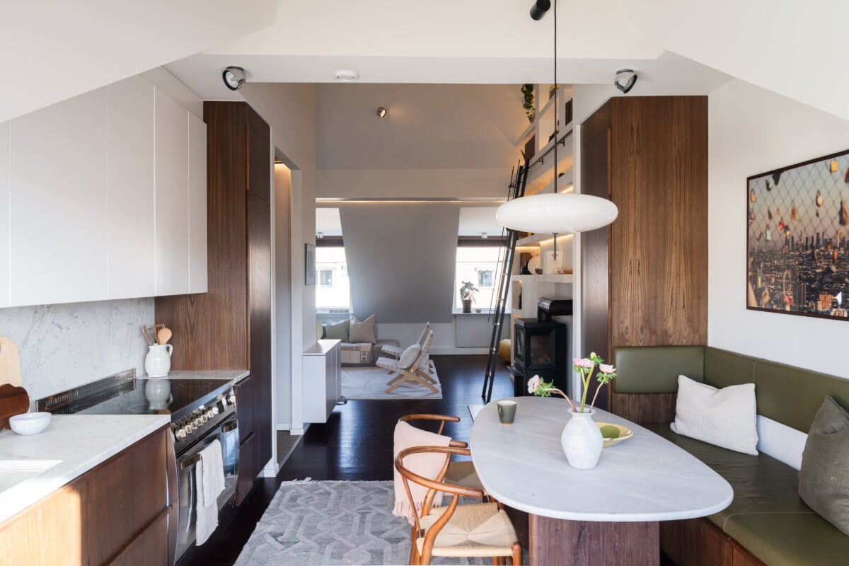 A Light Penthouse Apartment with Built-In Bookshelves 10 open plan kitchen living area