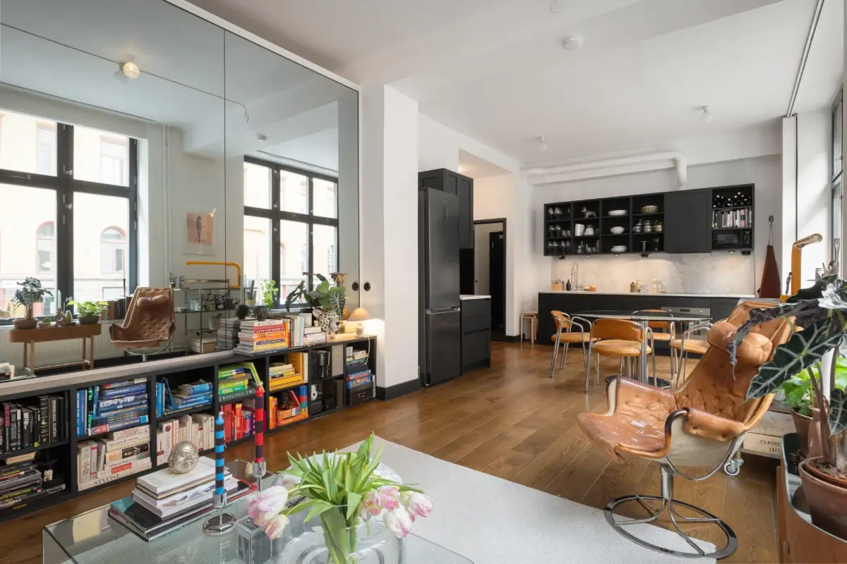 An Apartment with a Mirror Wall in a Former Stockholm Factory 9 open plan living room mirror wall