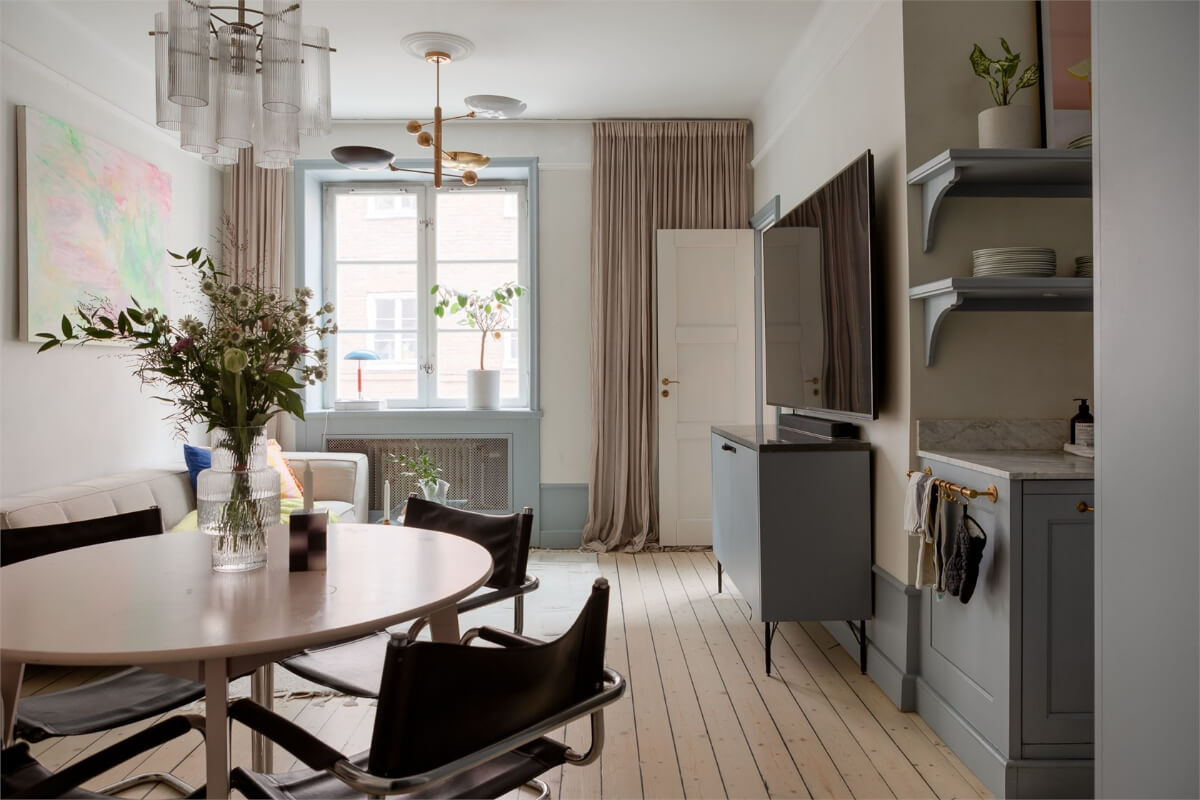 A Small Stockholm Apartment with a Blue Shaker Kitchen 8 open-plan living room wooden floorboards
