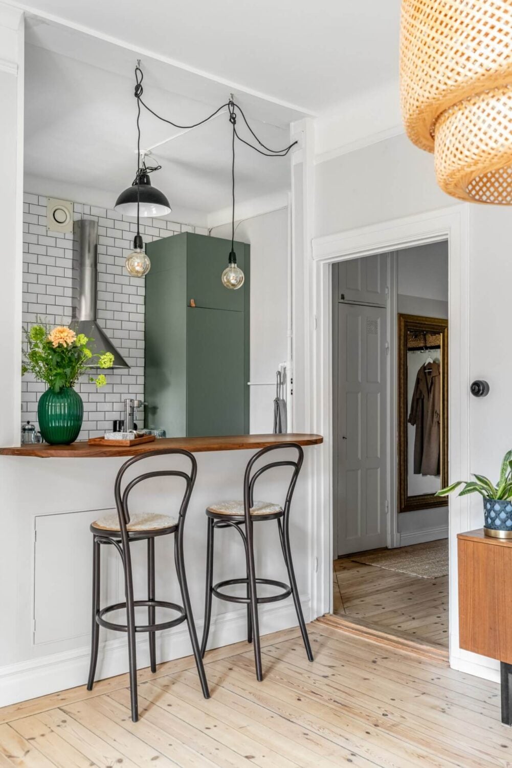 A Small Light-Filled Apartment with a Pink Bedroom 9 open-plan living space breakfast bar kitchen