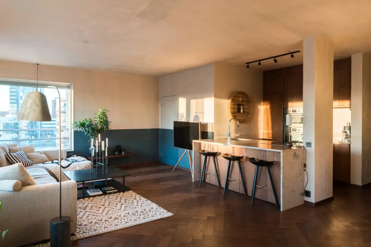 A Top Floor Swedish Apartment with a Huge Balcony 6 open plan living space dark herringbone floor
