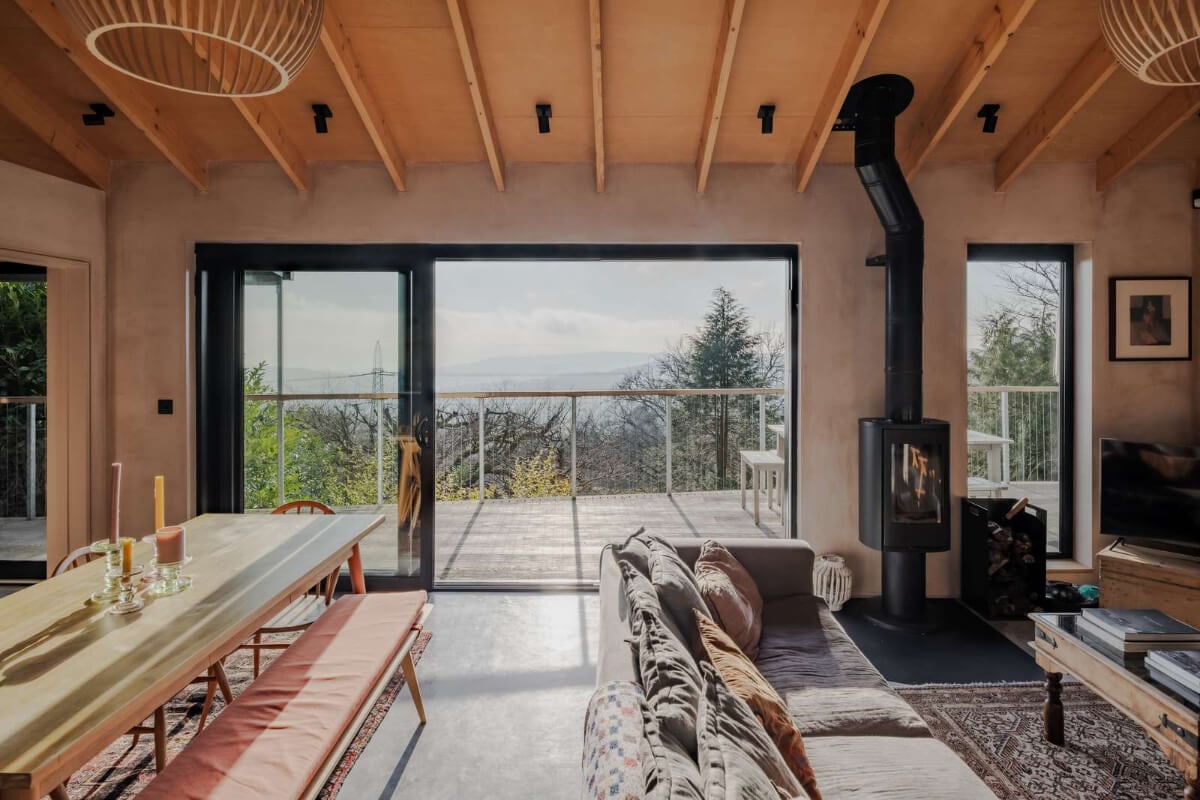 A Japanese-Inspired Timber Home with Views of a Lush Valley 1 open plan living space large terrace
