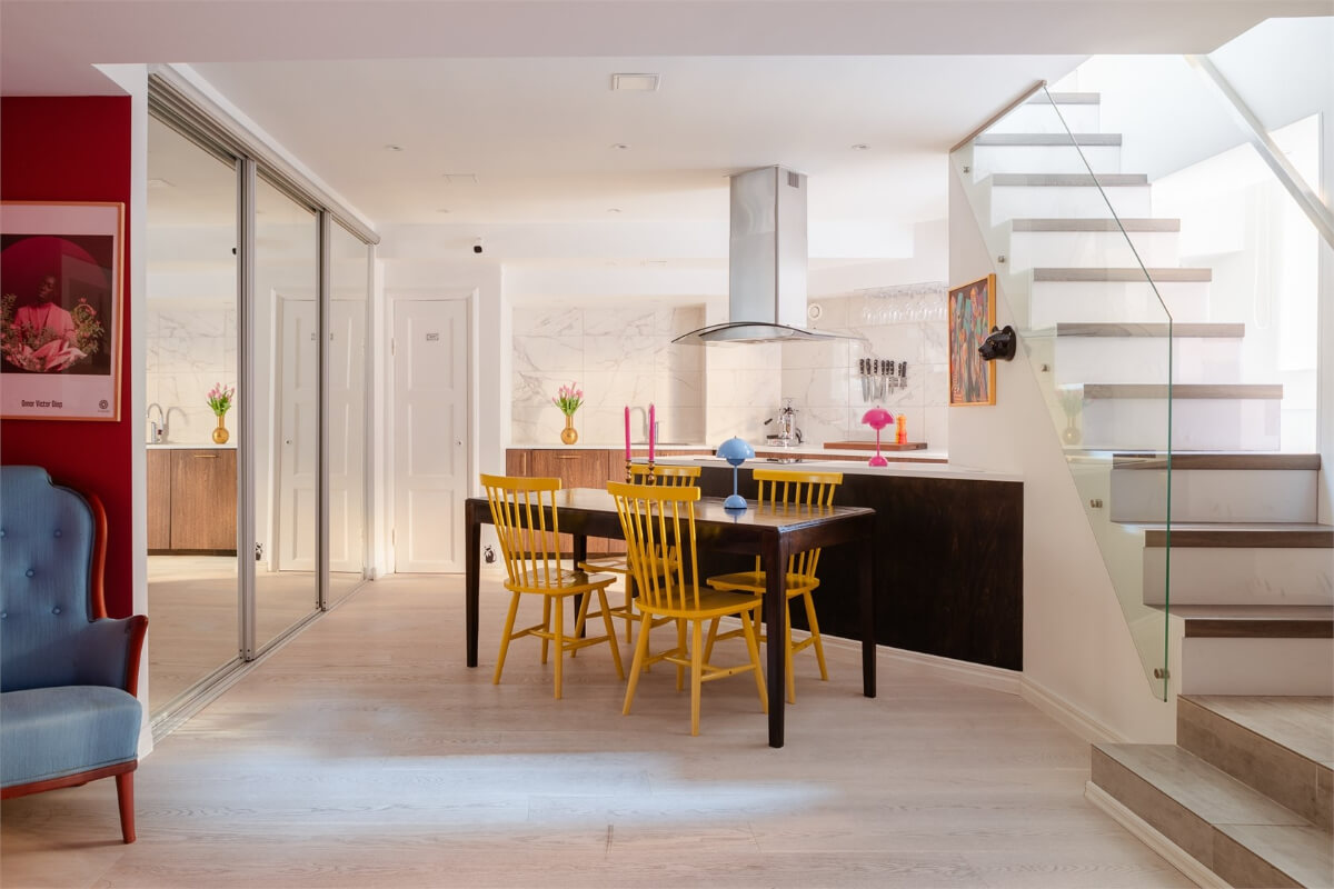A Colorful Basement Duplex Apartment in Stockholm 9 open plan living space mirror wardrobes basement room