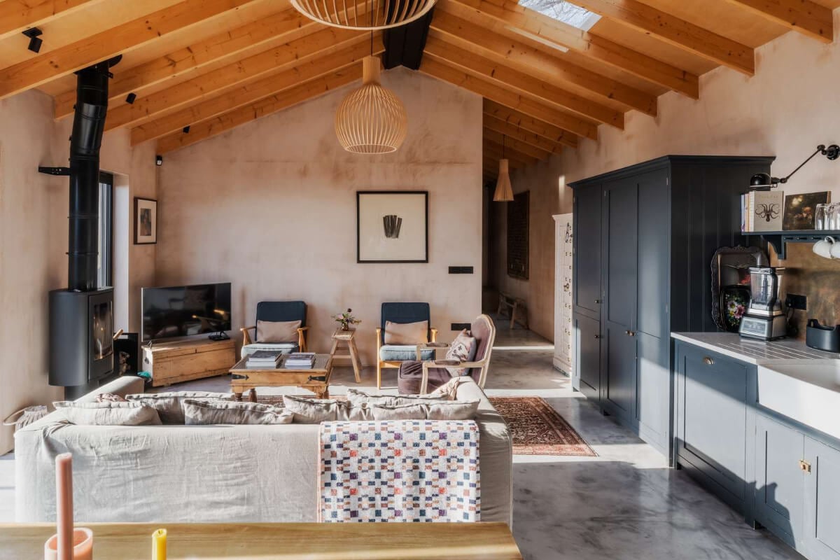 A Japanese-Inspired Timber Home with Views of a Lush Valley 6 open plan living space pitched timber roof devol kitchen