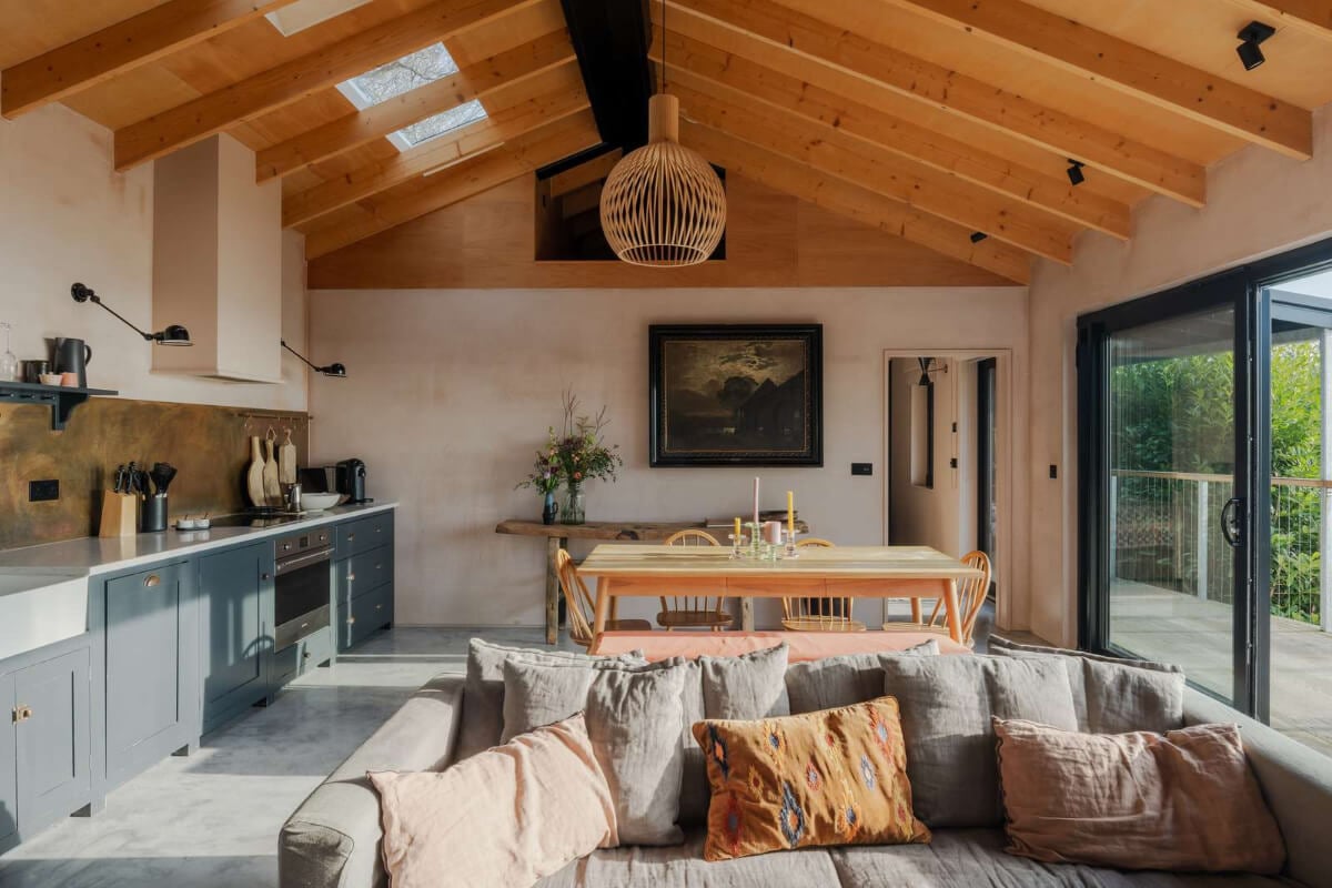 A Japanese-Inspired Timber Home with Views of a Lush Valley 2 open plan living space timber ceiling blue devol kitchen