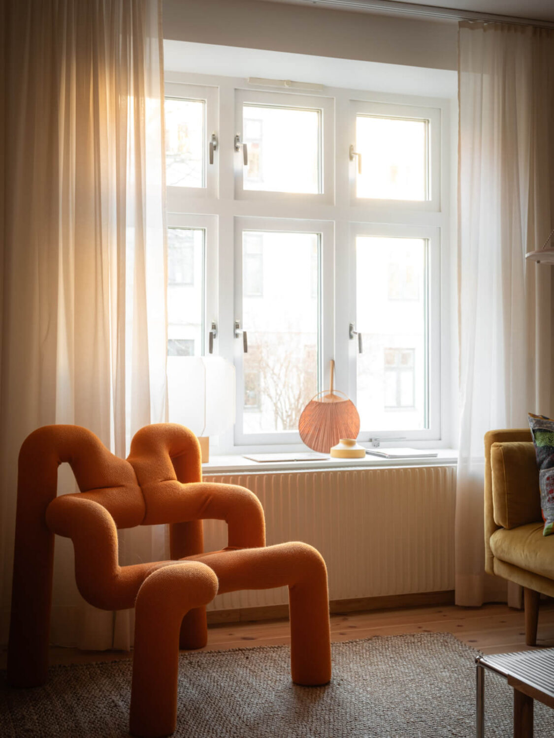 A Design Apartment in an Early 20th Century Building 5 orange chair