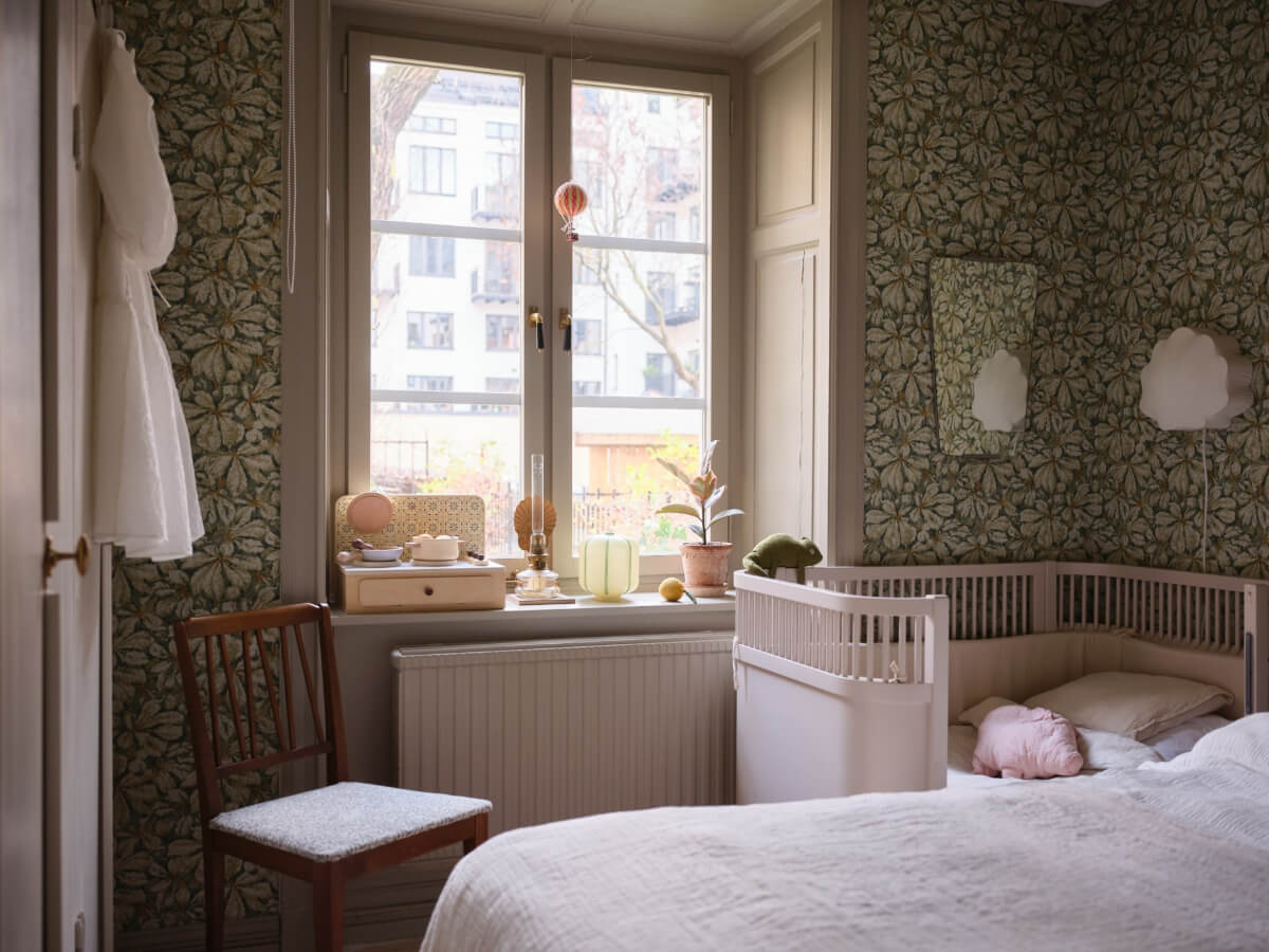 A Charming Vintage Apartment with Historic Wallpapers in Stockholm 12 original window bedroom green wallpaper
