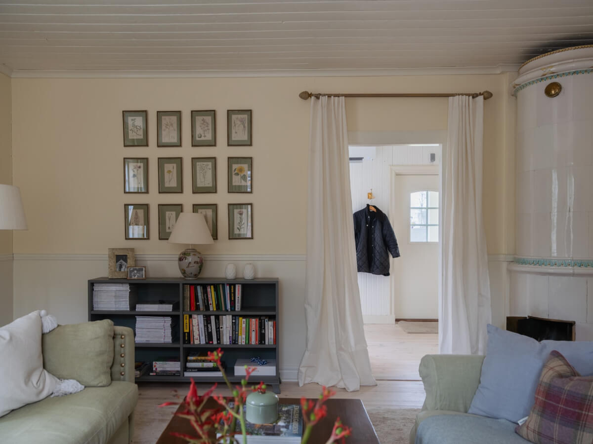 A Romantic Countryside Villa North of Stockholm 4 pale yellow living room fireplace