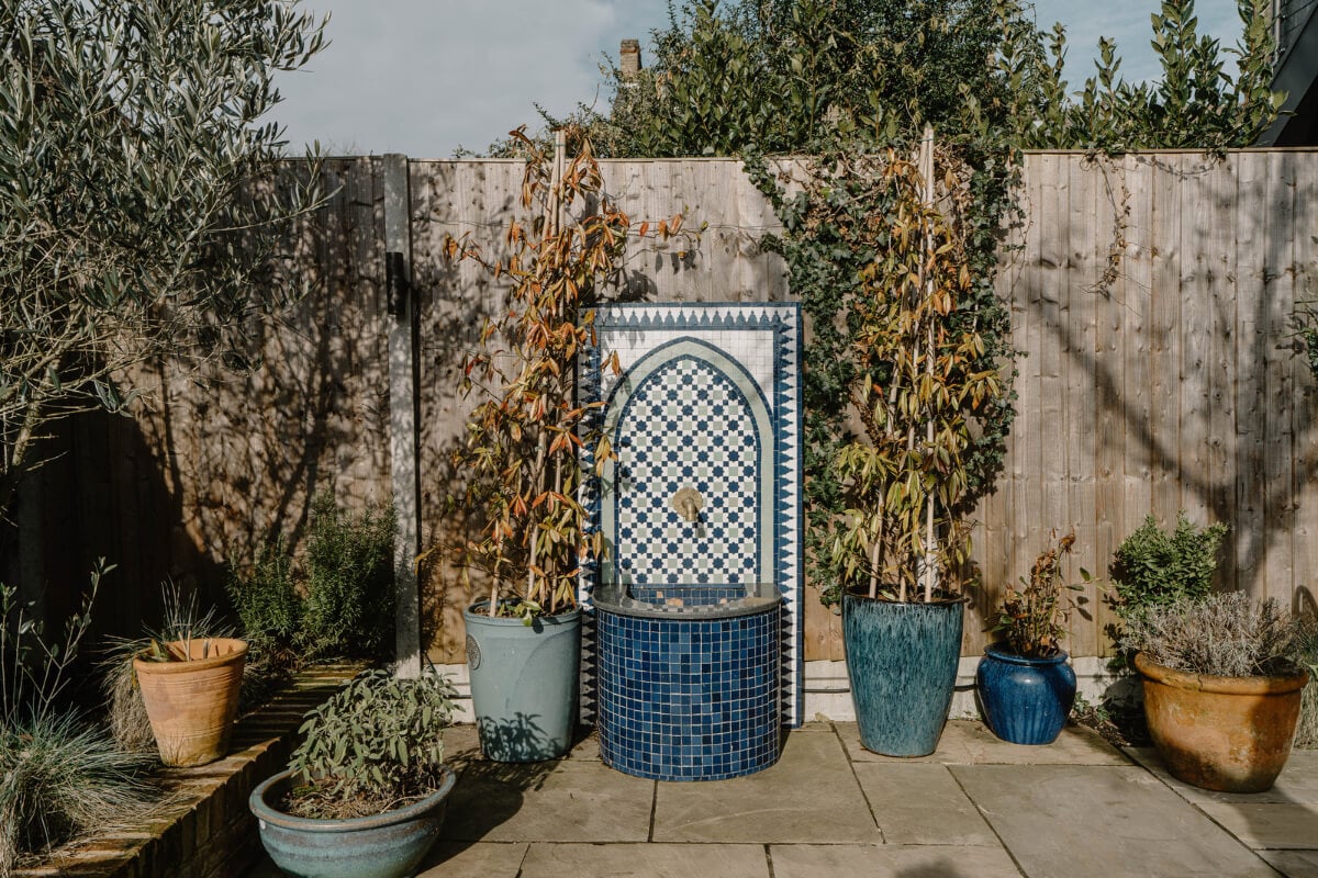 Moroccan-Inspired Designs in a Unique Artist Family Home in London 36 paved garden fountain