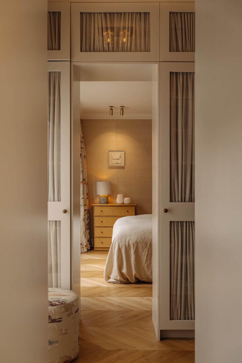 A Luxurious Apartment in Amsterdam with a Lovely Master Suite 14 peek into bedroom chevron floor