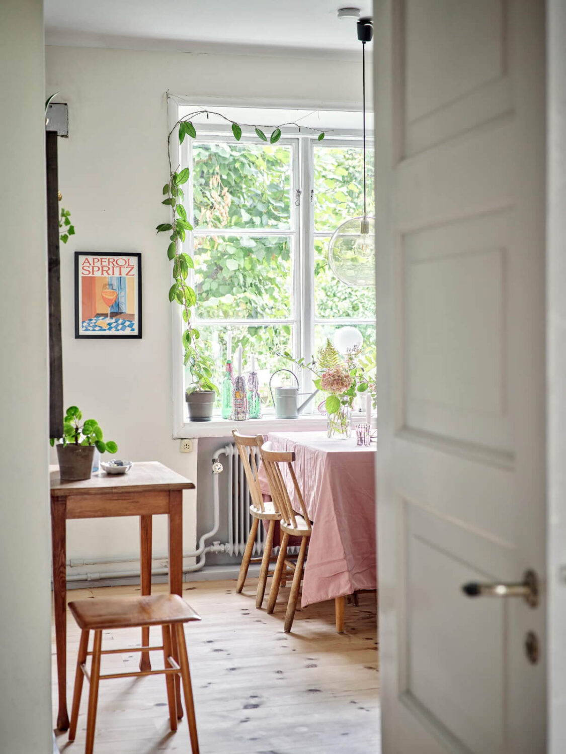 A Pink Ground Floor Studio Apartment with a Large Kitchen 7 peek into kitchen