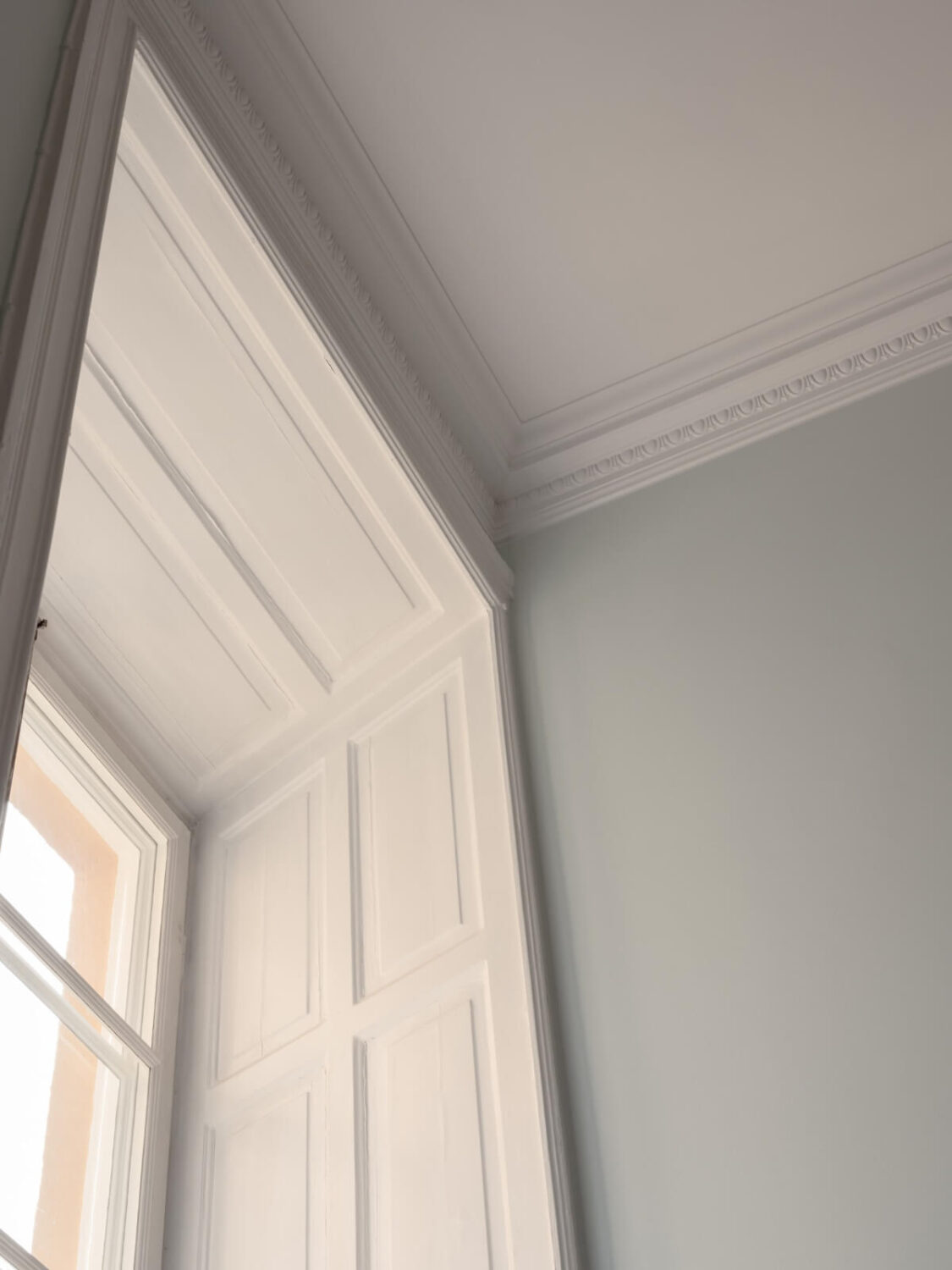 A Small Pink and Blue Apartment with High Ceilings in Stockholm 8 period features