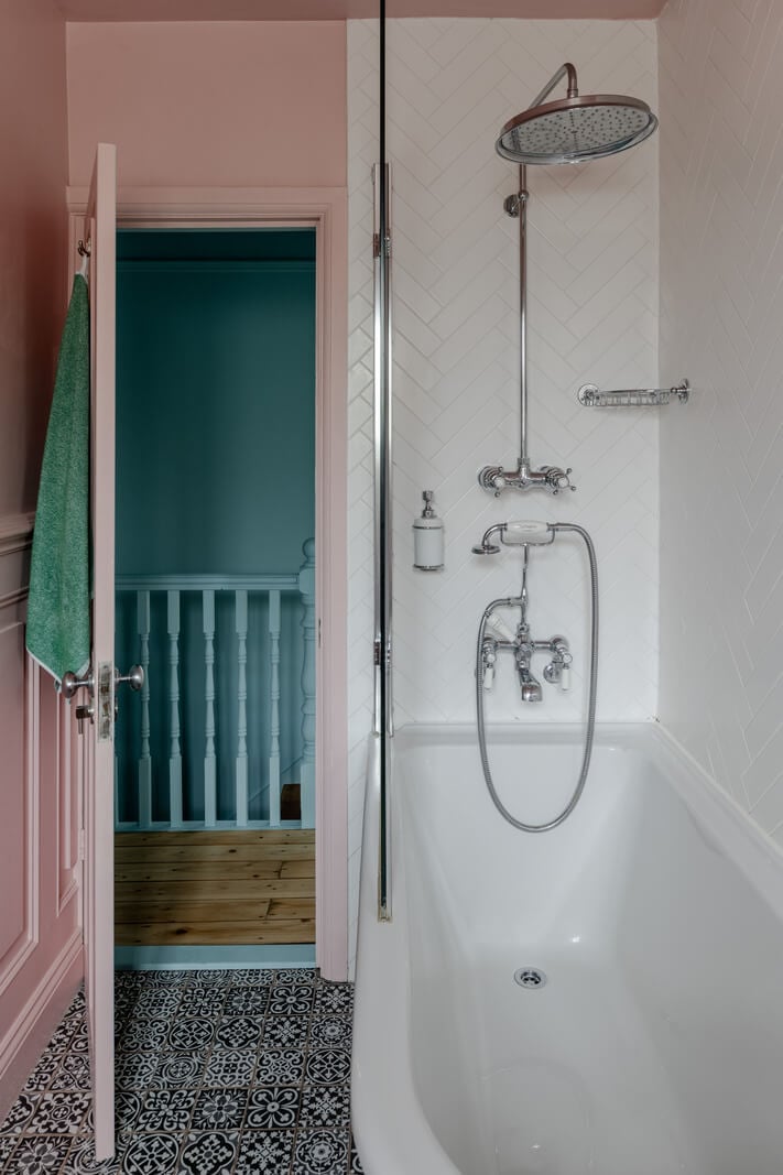 A Contrasting Color Palette in a Renovated Terrace House 17 pink bathroom moroccan style floor tiles