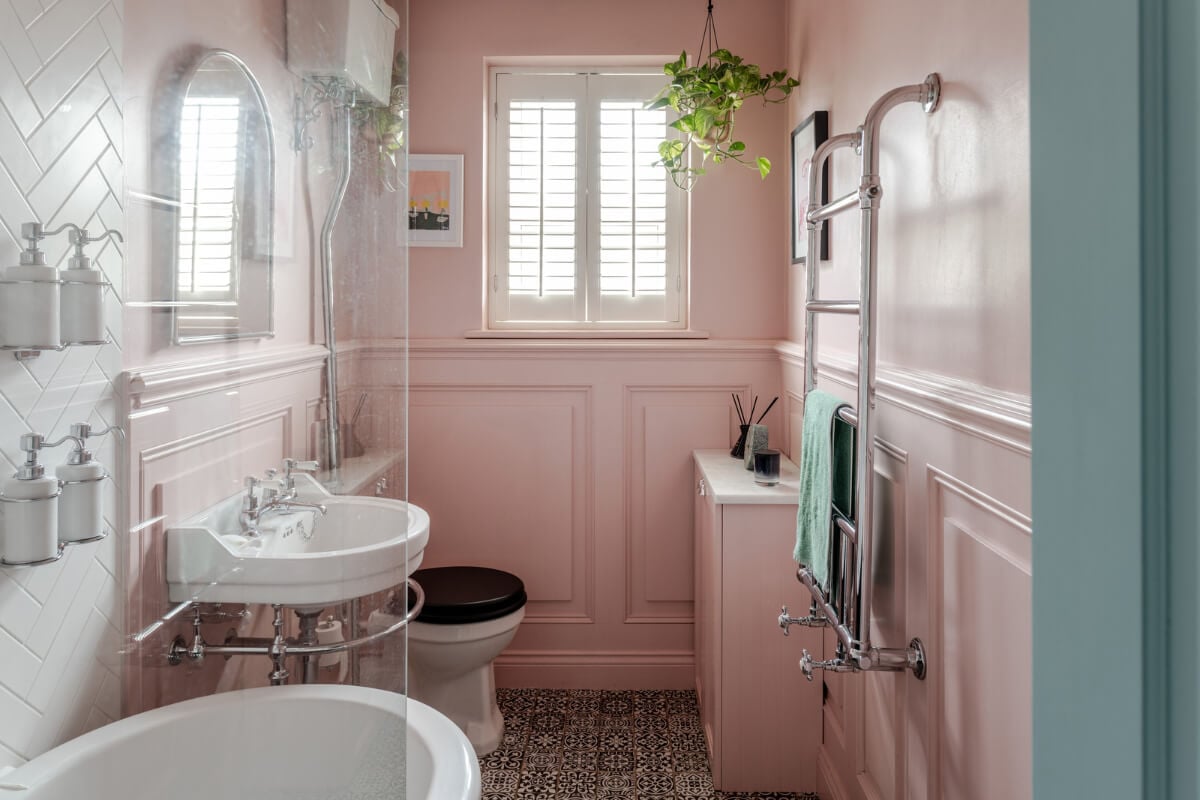 A Contrasting Color Palette in a Renovated Terrace House 16 pink bathroom with moroccan style floor tiles