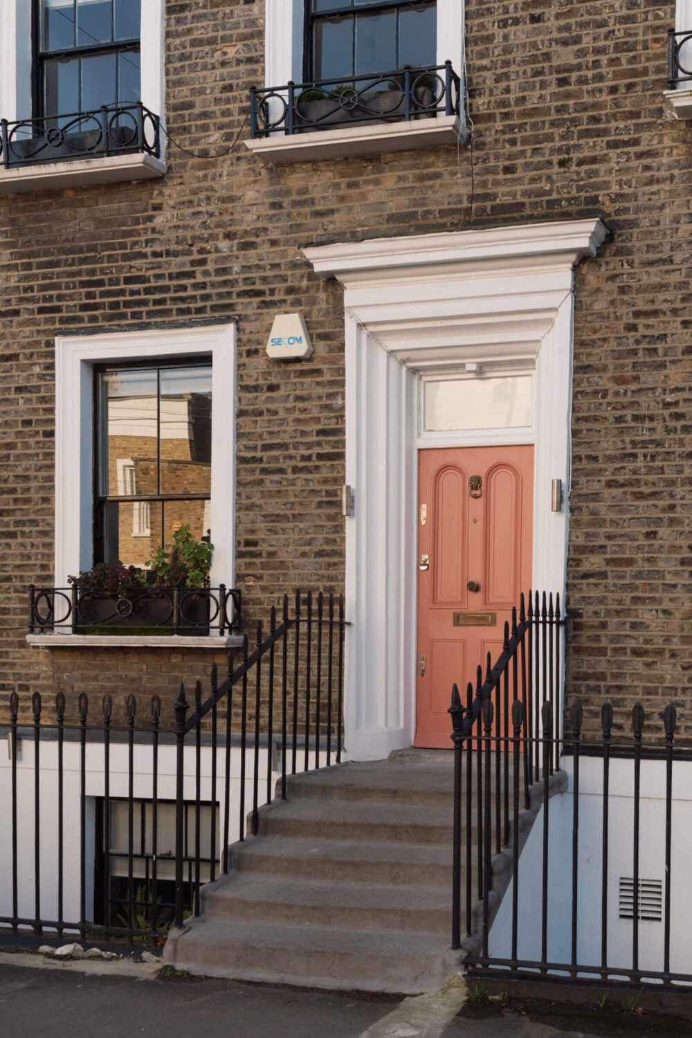 Contemporary Interiors and Preserved Details in an Early Victorian House 22 pink front door victorian house