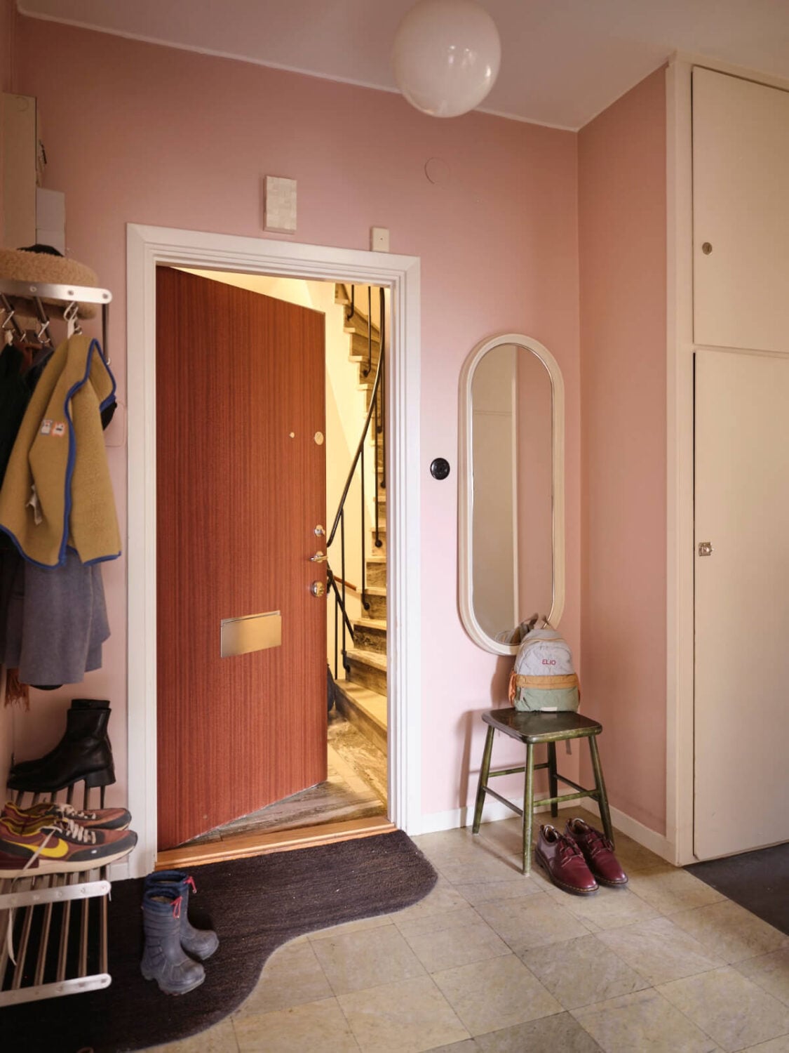 A Light Corner Apartment with Yellow Color Accents 24 pink hall A Light Corner Apartment with Yellow Color Accents