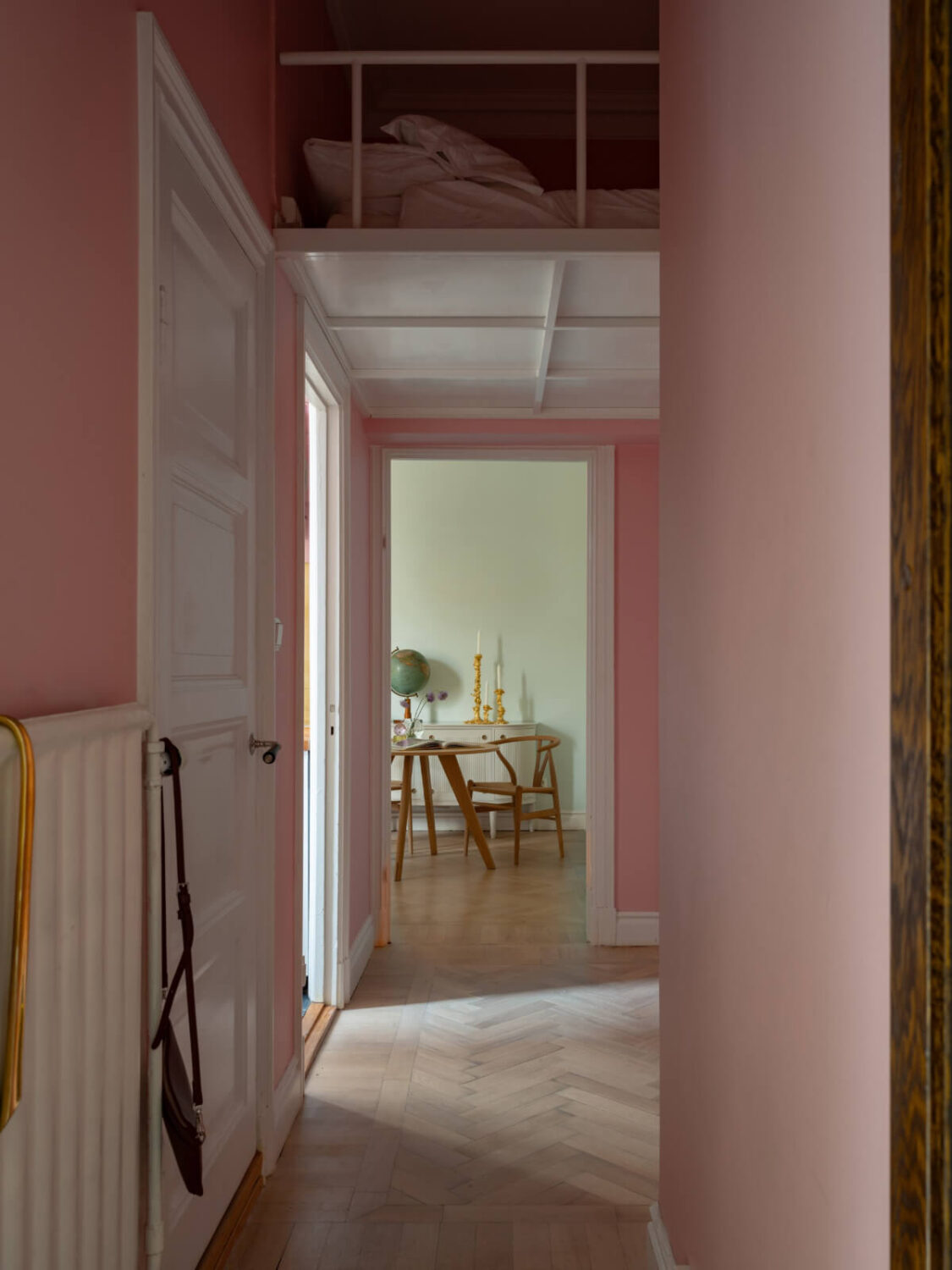 A Small Pink and Blue Apartment with High Ceilings in Stockholm 21 pink hall sleeping loft