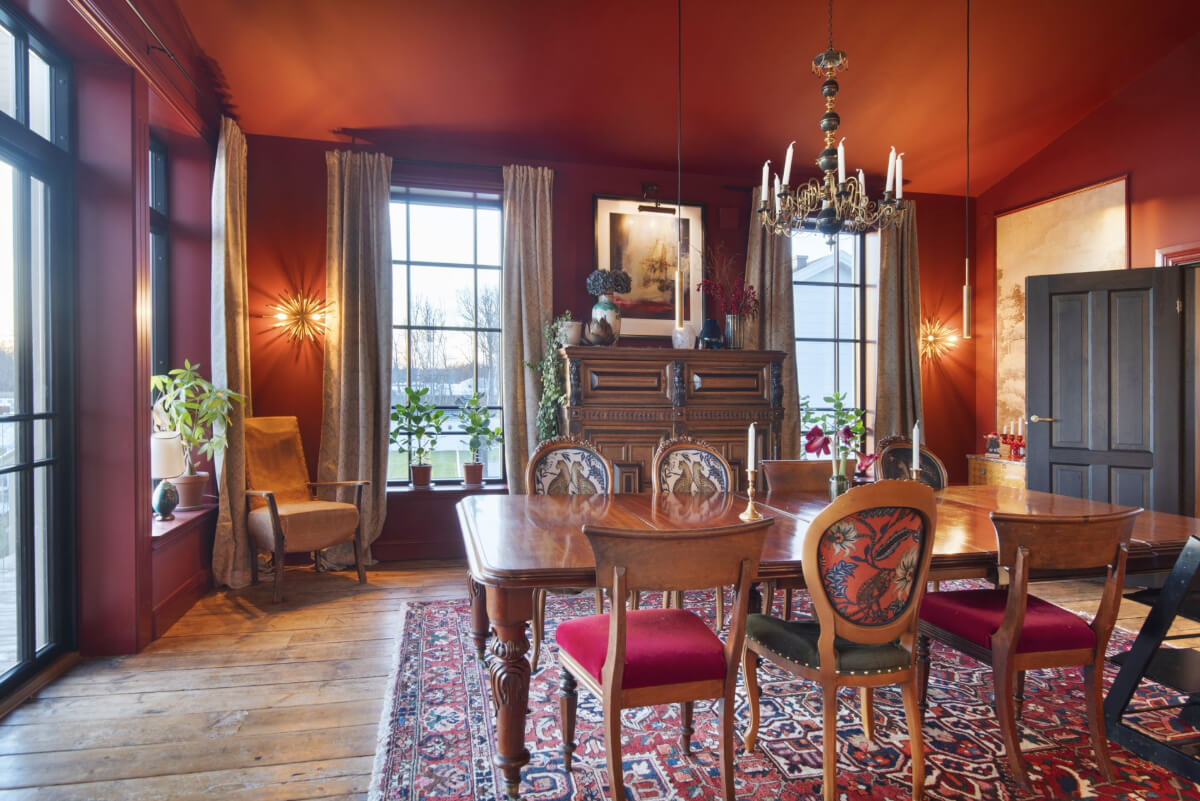 English Manor Style Interiors in a New Swedish Home with Lake Views 7 red dining room antique furniture