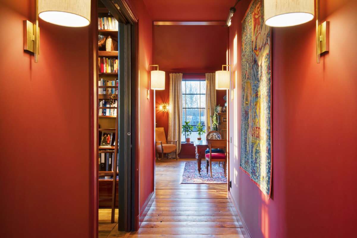 English Manor Style Interiors in a New Swedish Home with Lake Views 5 red hallway wooden floorboards