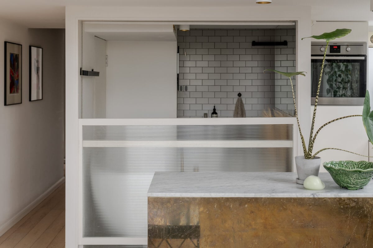 A Plant-Filled Loft Apartment in a Former Clothing Factory 11 reeded glass wall bathroom