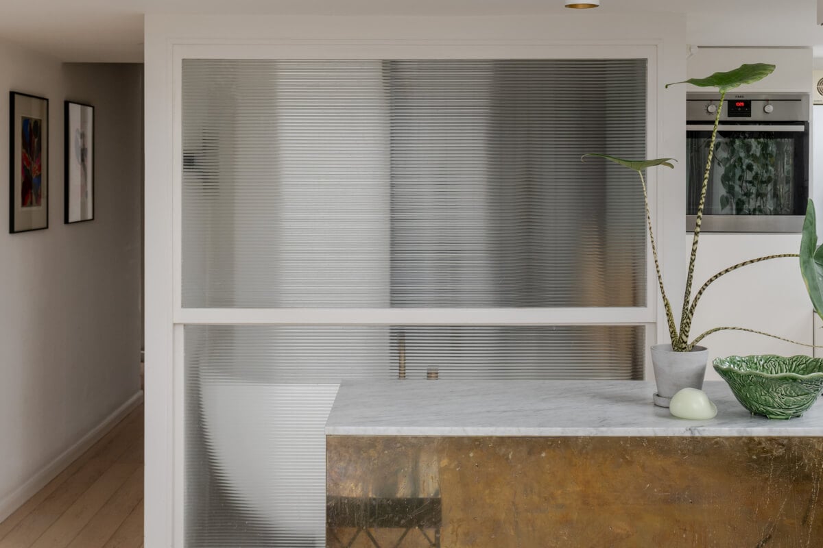 A Plant-Filled Loft Apartment in a Former Clothing Factory 10 reeded glass wall