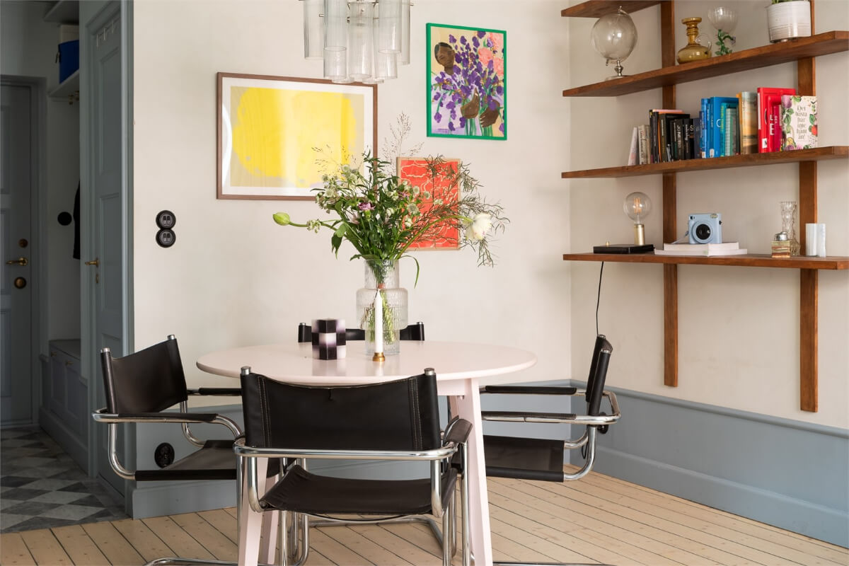 A Small Stockholm Apartment with a Blue Shaker Kitchen 10 round dining table and shelves