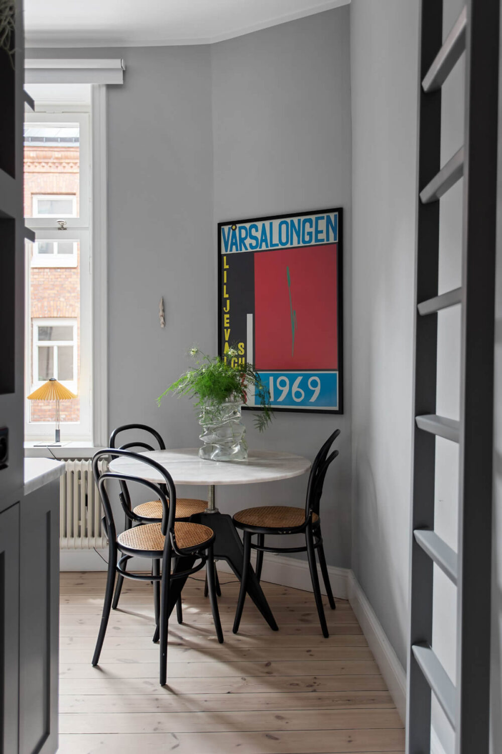 A Gray Studio Apartment with an Industrial Room Divider 14 round marble top kitchen table