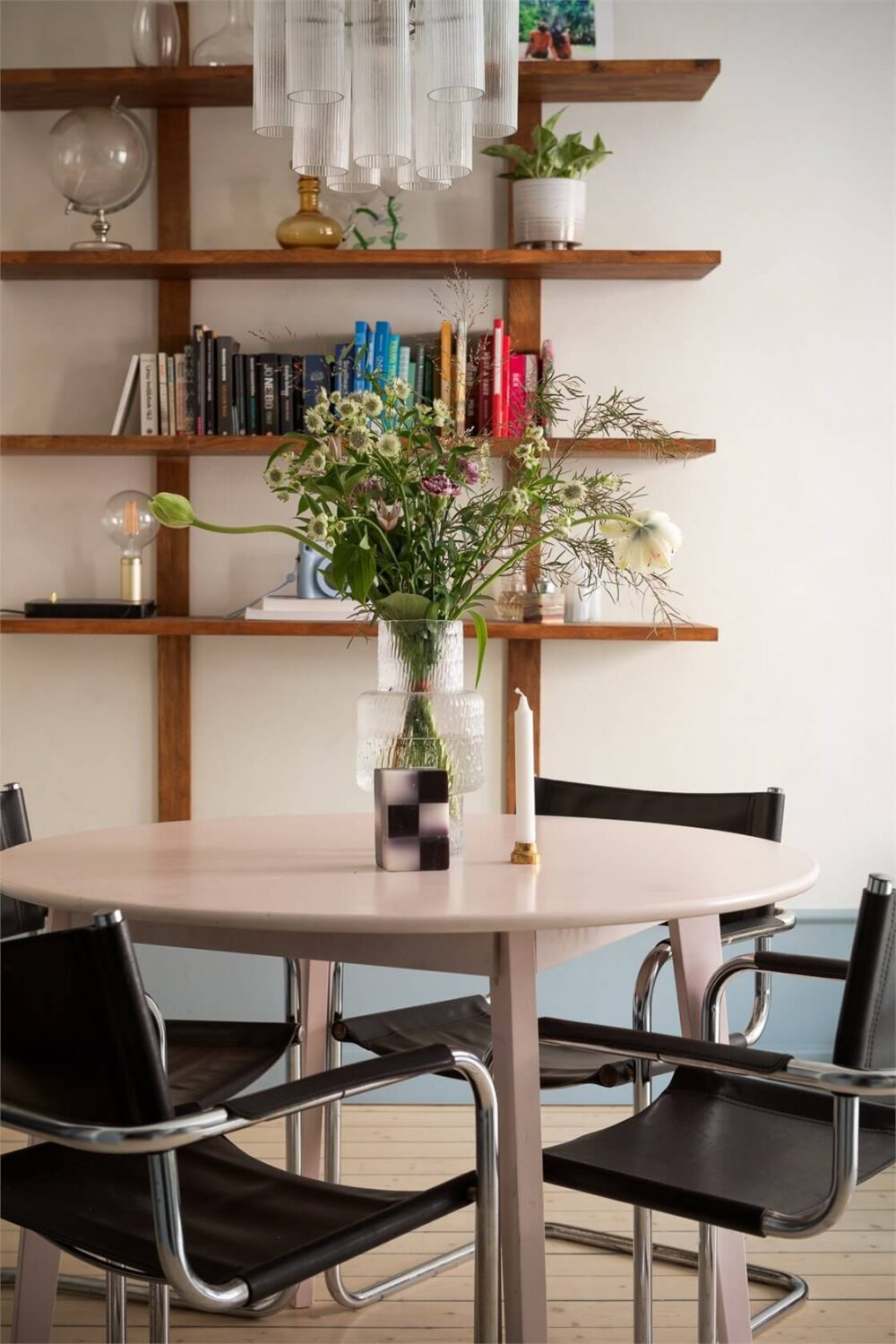 A Small Stockholm Apartment with a Blue Shaker Kitchen 11 round table wooden shelves