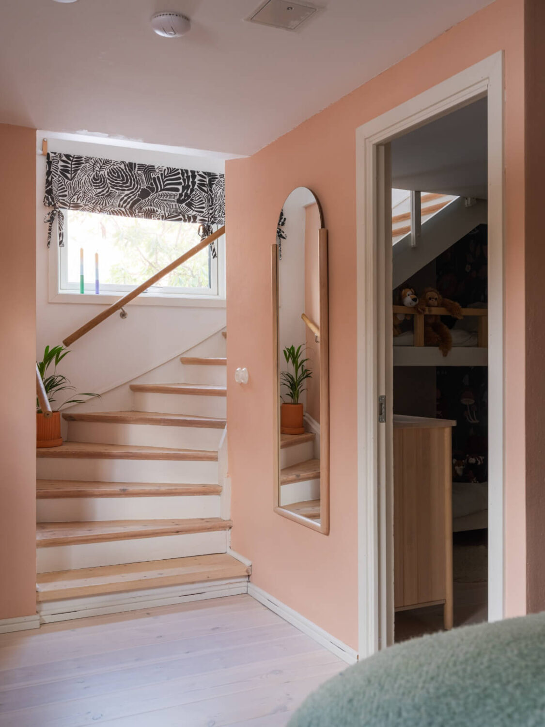 Colorful Decor in a Charming Family Duplex Apartment in Stockholm 24 salmon pink hall