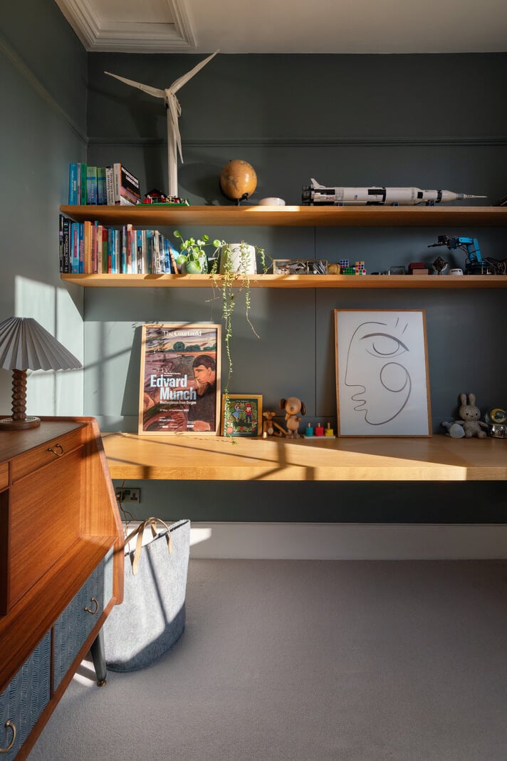 Contemporary Interiors and Preserved Details in an Early Victorian House 18 shelves moody wall color