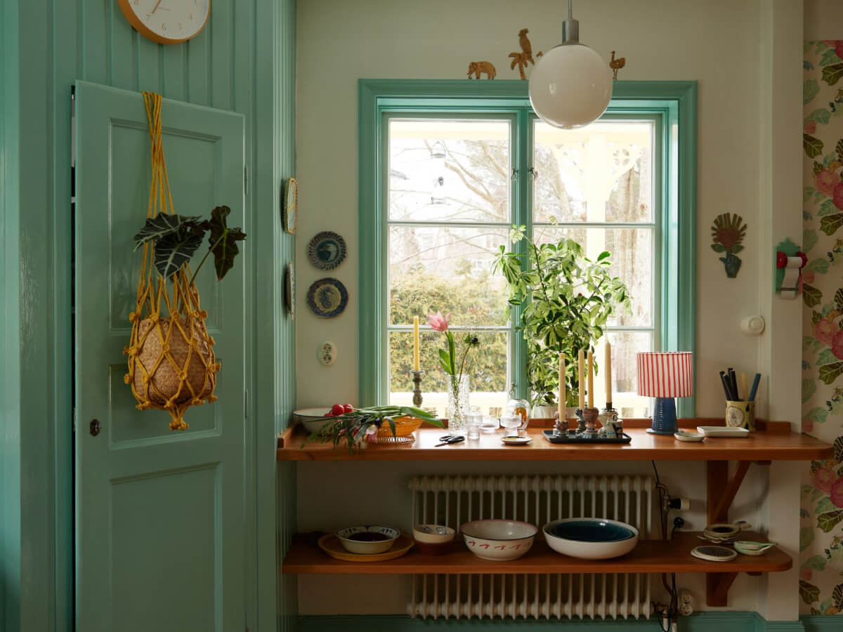 Colorful Interiors in a Wonderful Early 20th Century Swedish Villa 7 shelves under kitchen window