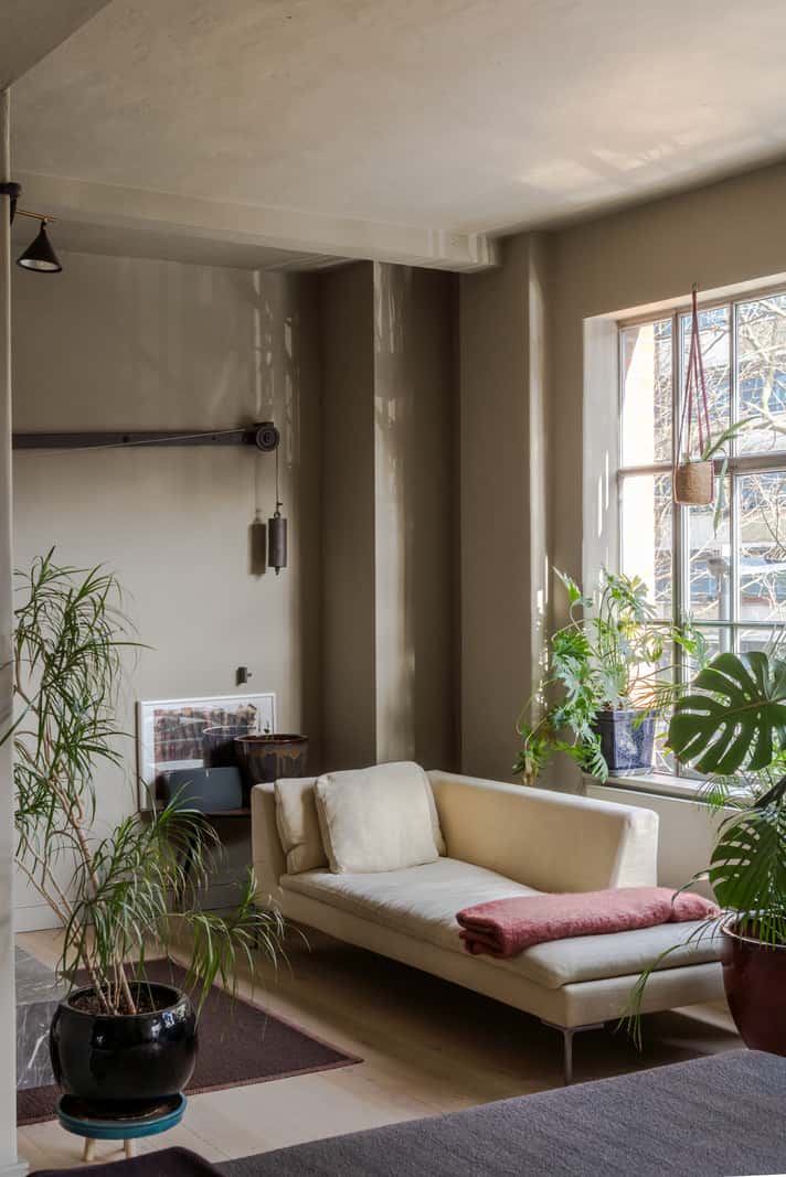 Soft-Colored Contemporary Interiors in a Warehouse Apartment 3 sitting area plants warehouse conversion