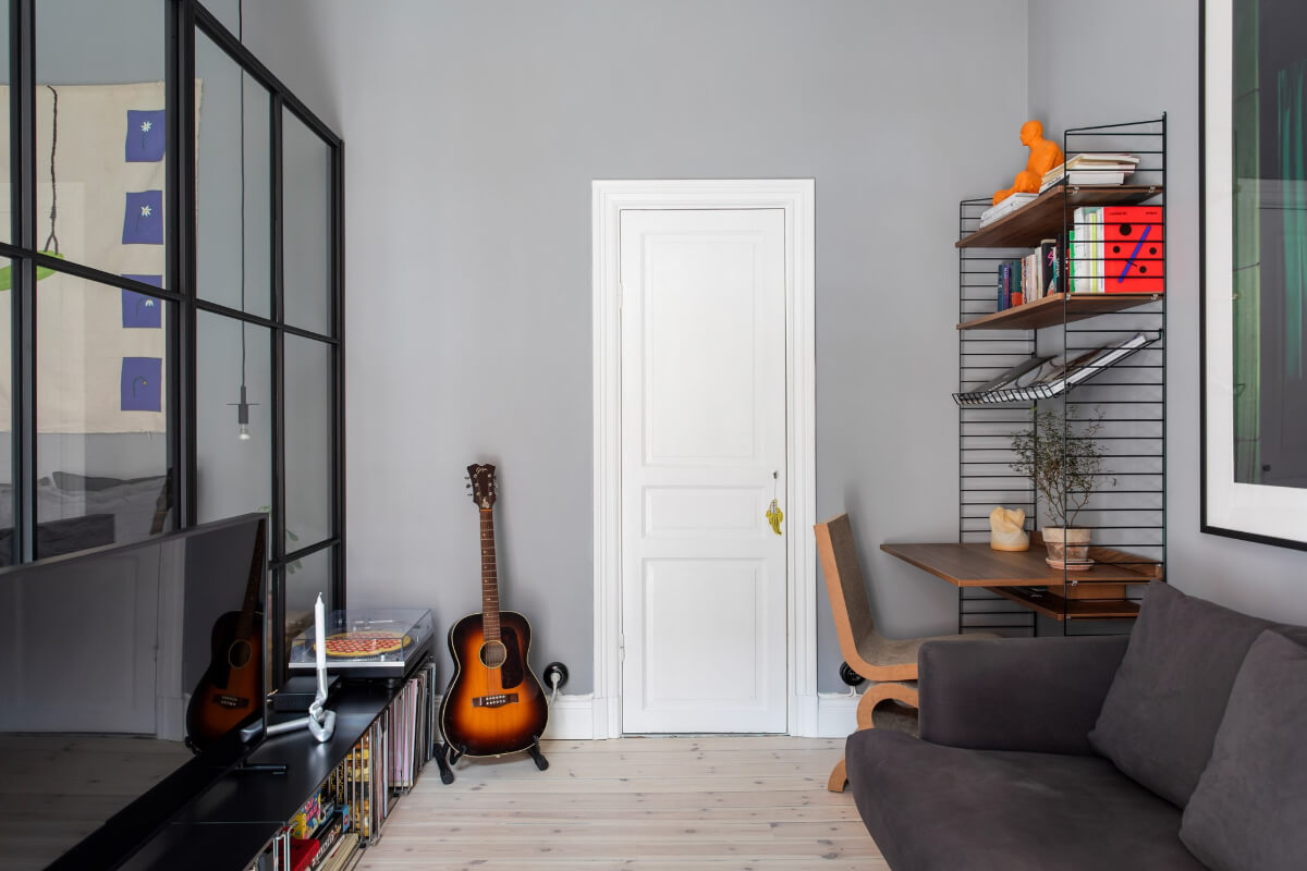 A Gray Studio Apartment with an Industrial Room Divider 8 sitting area with desk studio apartment