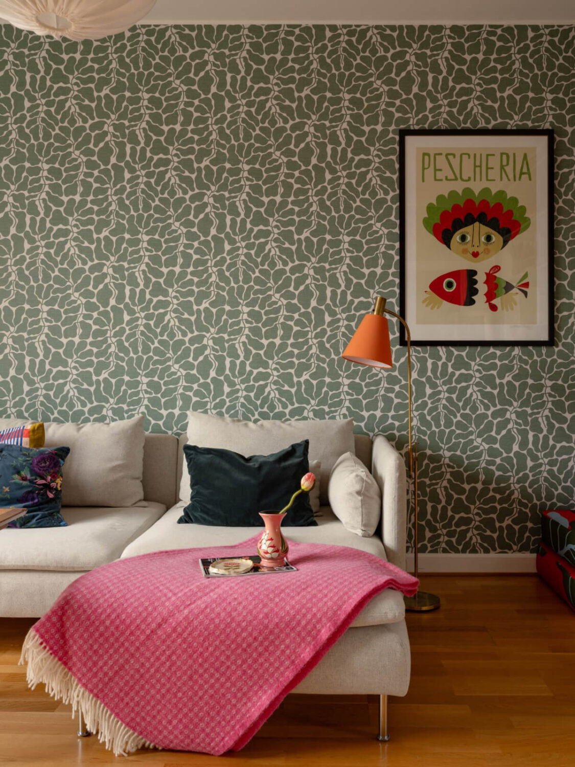 Colorful Wallpapers in a Well-Planned 1940s Apartment 3 sitting room green wallpaper orange lamp