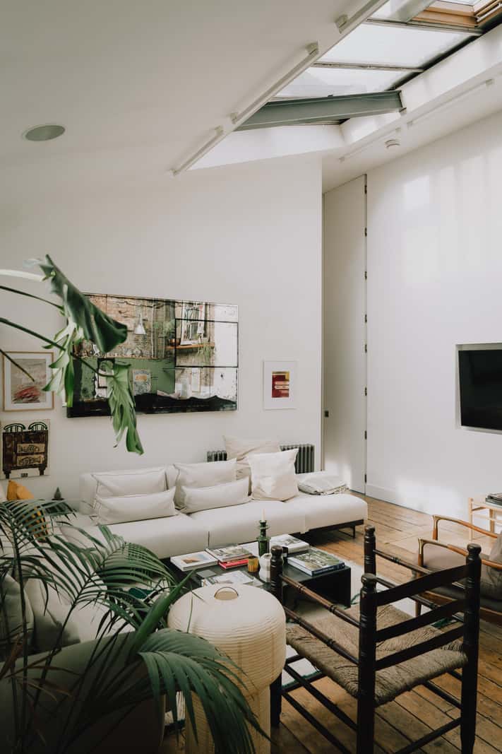 A London Basement Apartment in a Former Wood Workshop 2 sitting room pitched roof skylights