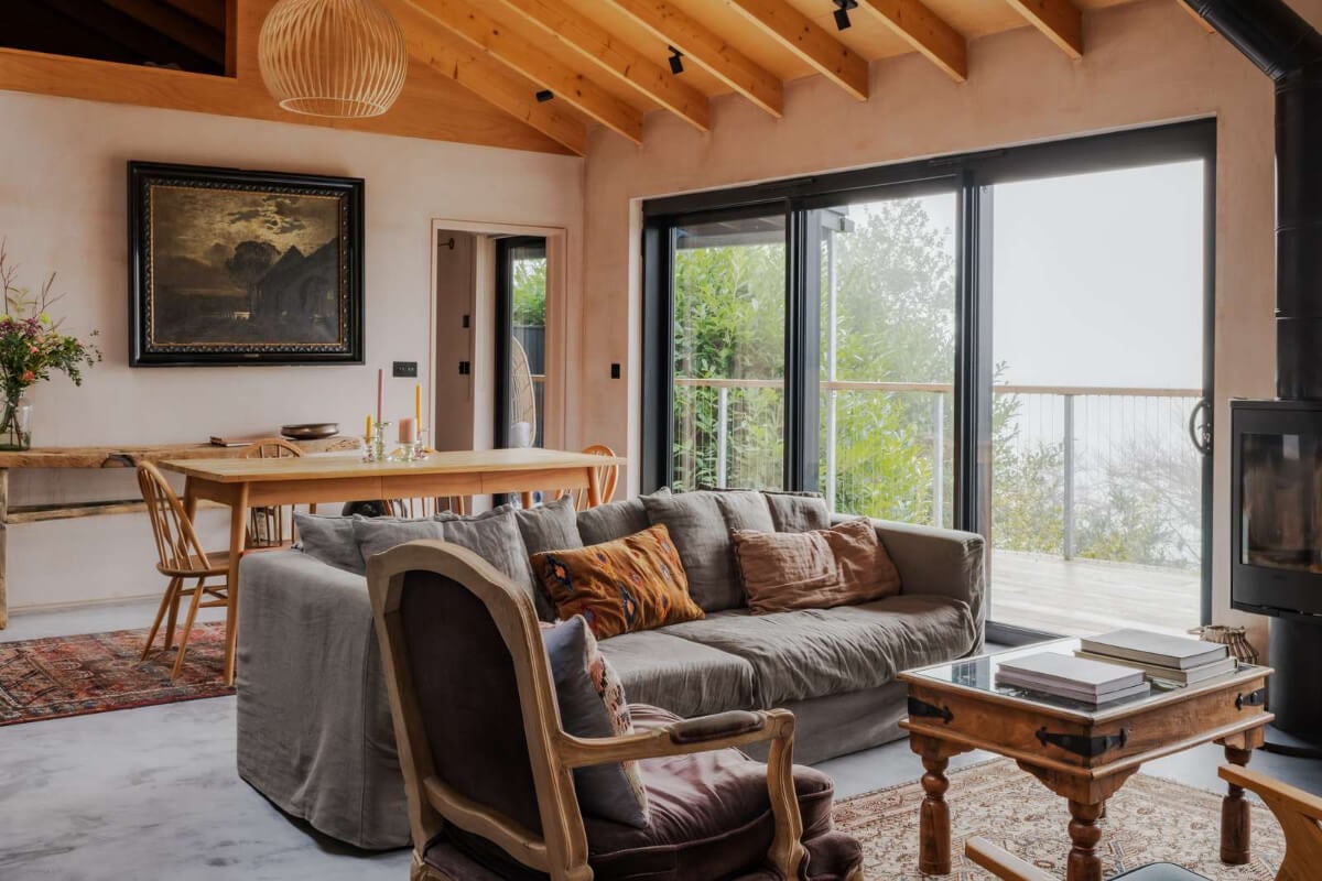 A Japanese-Inspired Timber Home with Views of a Lush Valley 5 sitting room with log burner